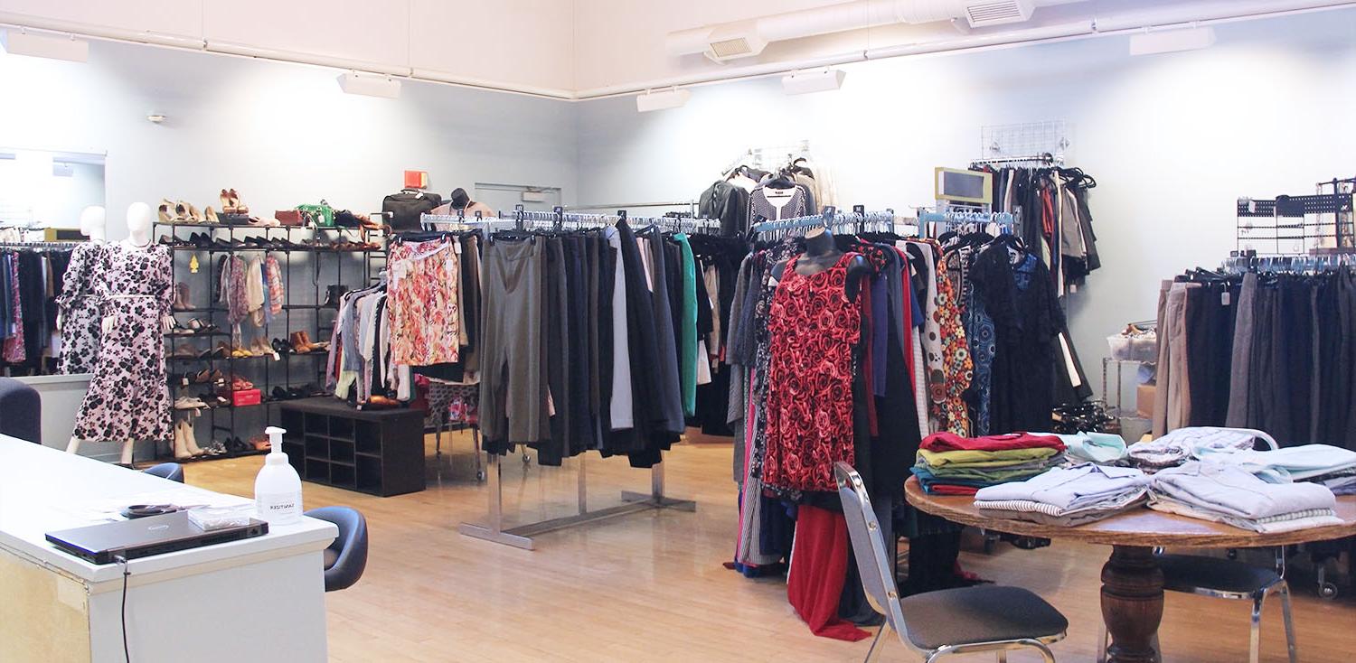 JCC's Career Closet on the Jamestown Campus is a large room with clean professional clothing arranged on hangers, wall mounts, and tables, similar to a department store. Several mannequins wear sample outfits, and at the front of the room is a private changing room and front desk for assistance.